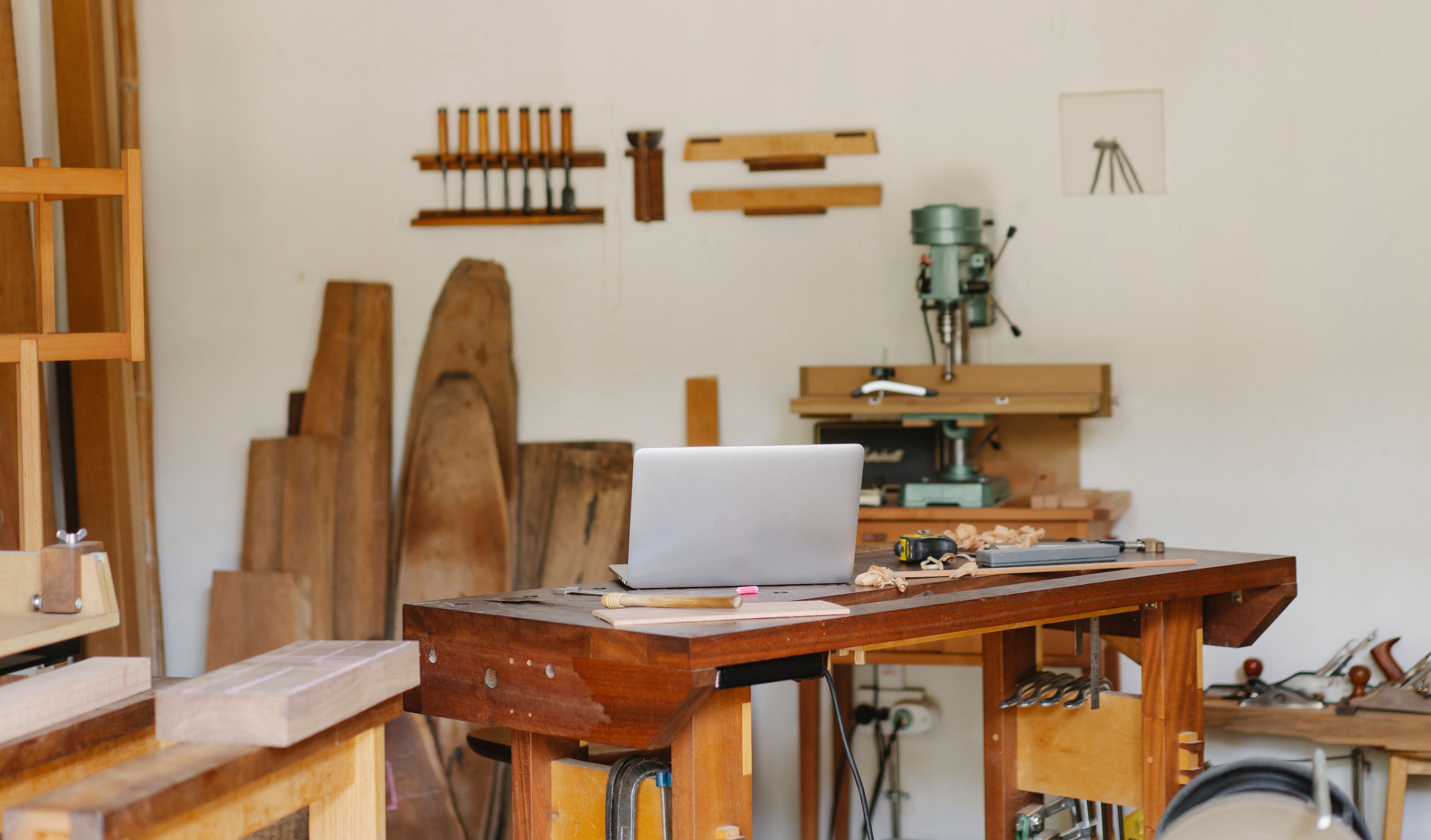 Wood workshop with laptop and workbench